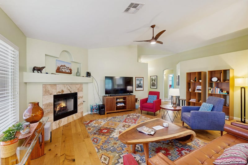 Features vaulted ceilings, plenty of seating, fireplace, and smart TV.