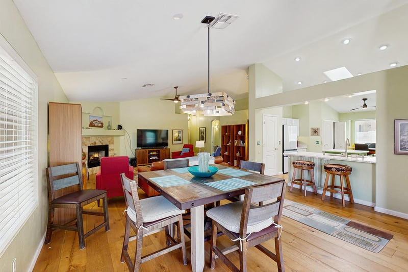 Just behind the living room is the dining area with a table and chairs for 4 guests.