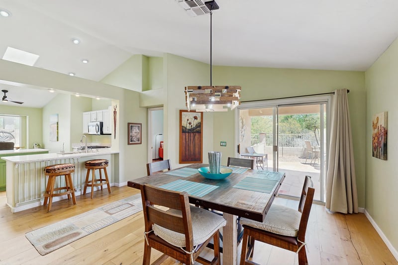 Patio access can be seen behind the dining area.