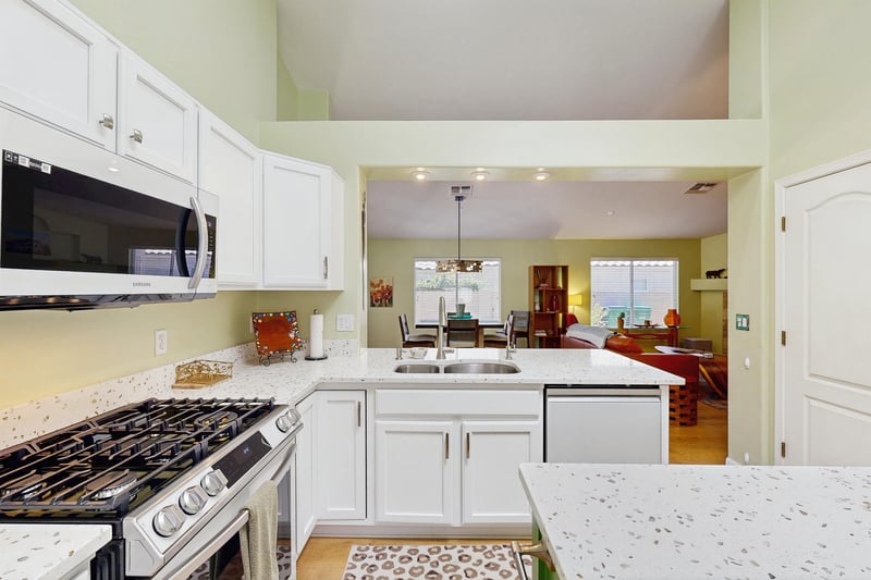 New Samsung white glass front appliances, plenty of counter space, kitchen island, counter seating for 2, and breakfast nook.