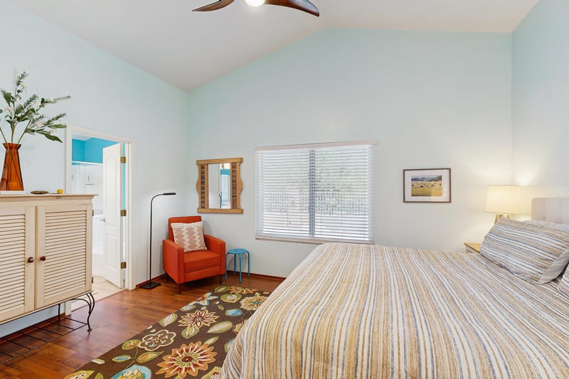 King size bed, reading area, and ensuite bathroom.