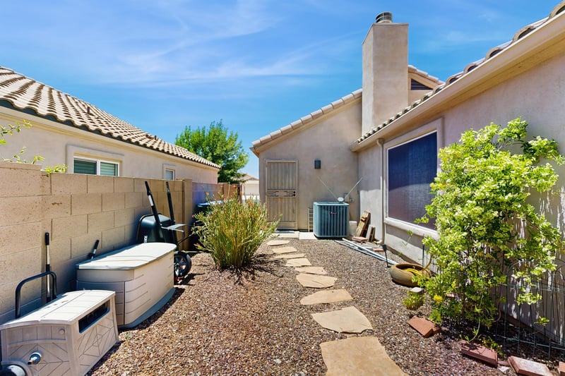 Walkway along the side of the home.