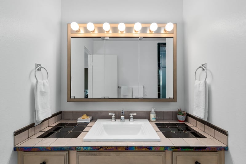 Vanity area with counter space.