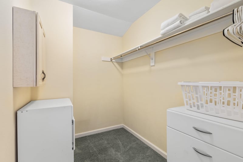 Walkin closet in primary room.