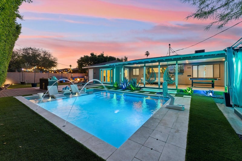 Private pool, hot tub, firepit, mini golf and outdoor patio area with flatscreen TV, pool table, and outdoor seating.