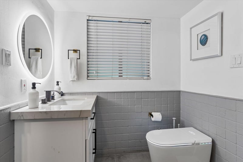 Ensuite bathroom with stand alone shower attached to the officeextra bedroom.