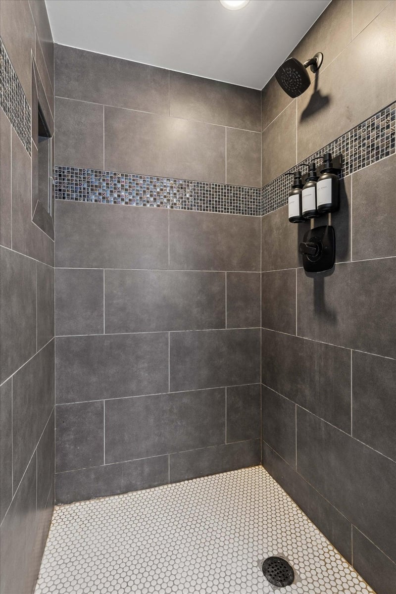Ensuite bathroom with stand alone shower attached to the officeextra bedroom.