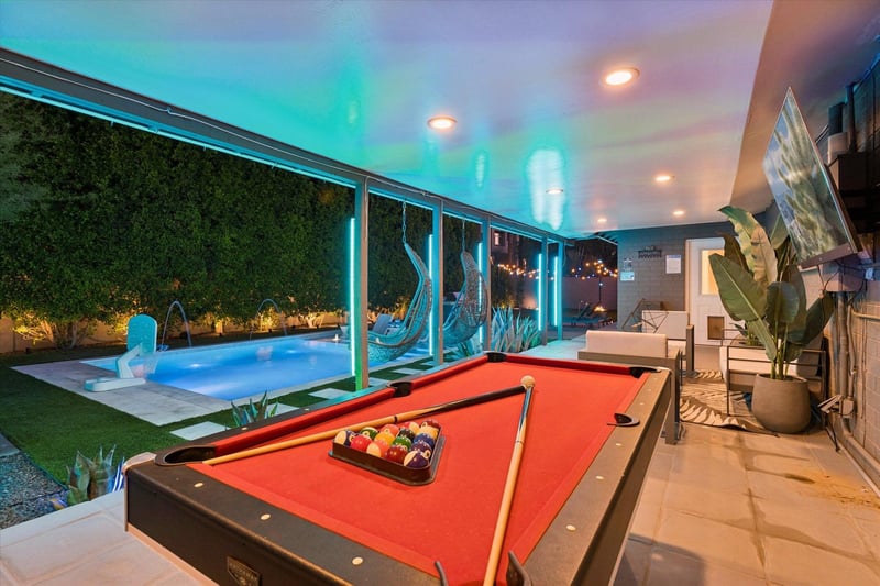 Equipped with outdoor seating, TV, pool table, swinging chairs, misters and speakers.