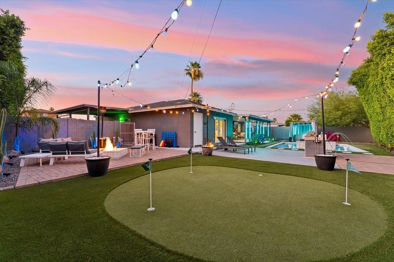 Putting green with string lights to play under the stars