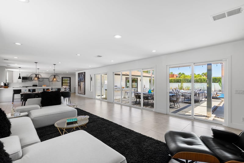 View of the expansive windows in the living room, dining room, and kitchen area.