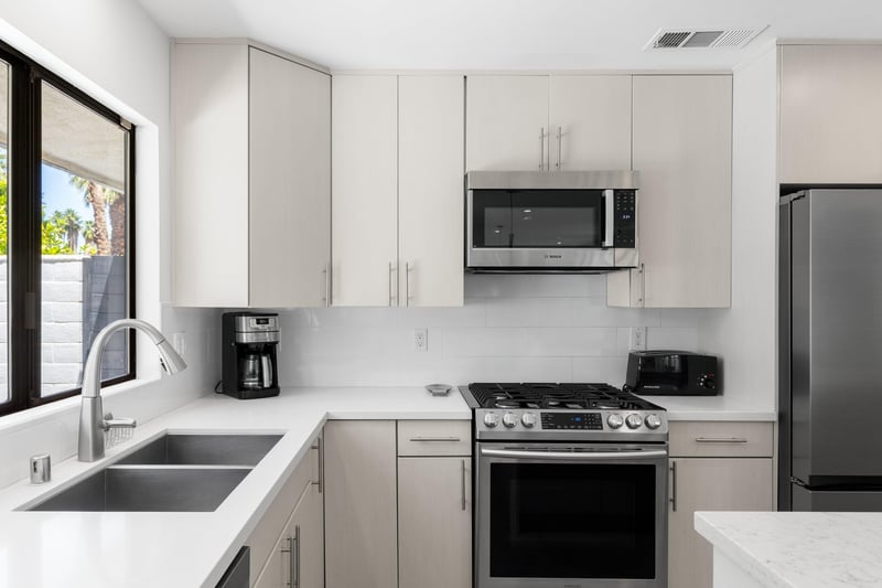 Stainless steel appliances and a coffee maker.