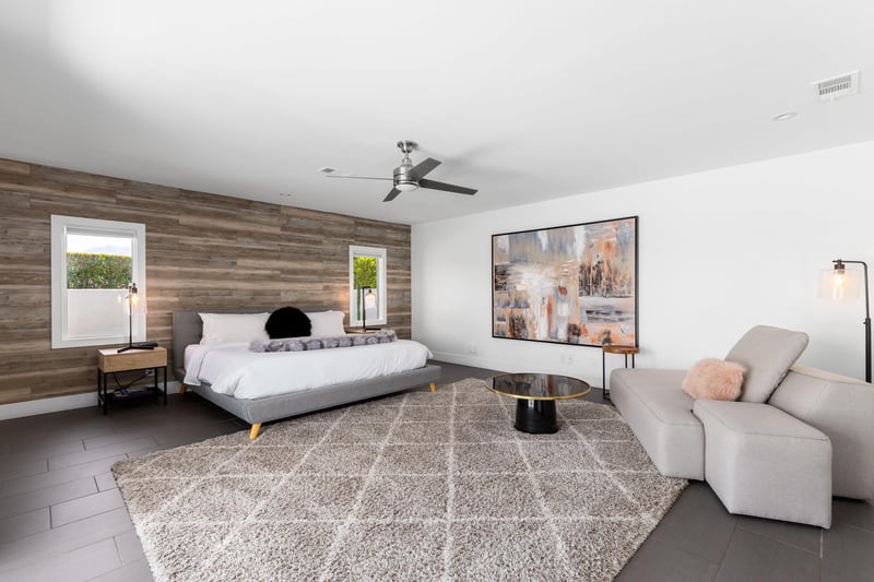 King size bed, reading area, ensuite bathroom and direct patio access.