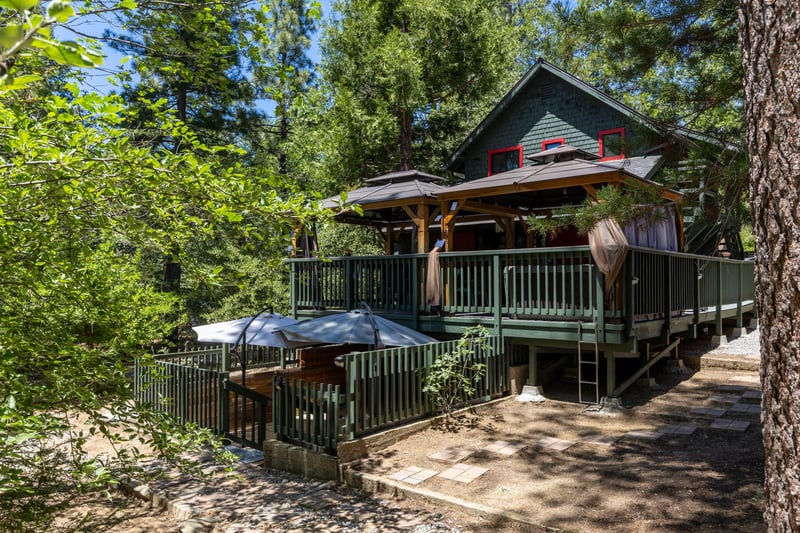 View of the entrance to the lower level outdoor seating area below the main deck.