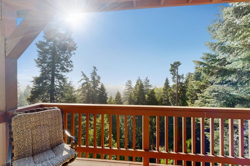 Beautiful, expansive deck with mountain  treetop views, outdoor dining, and BBQ.