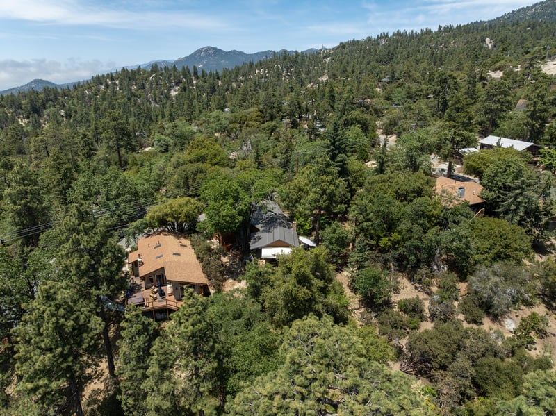 Nestled in the trees, mountain views.
