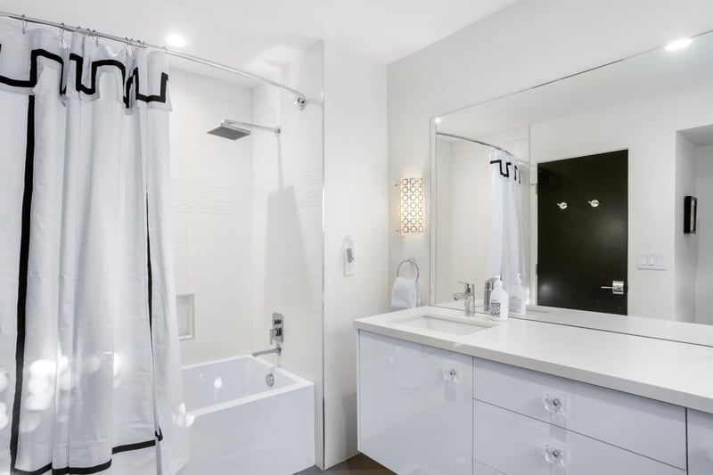 Ensuite bath featuring a bathtub