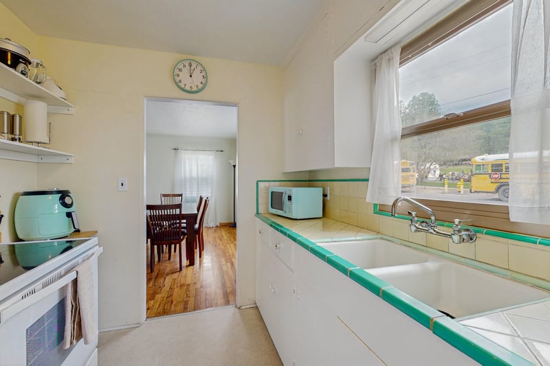 View of kitchen area and dining area.