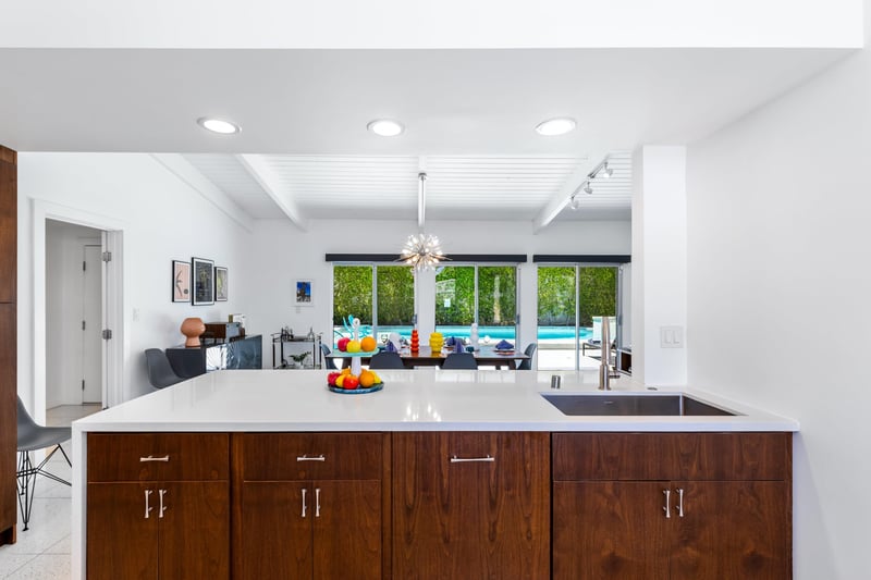 View of the island, dining area and patio from the kitchen.