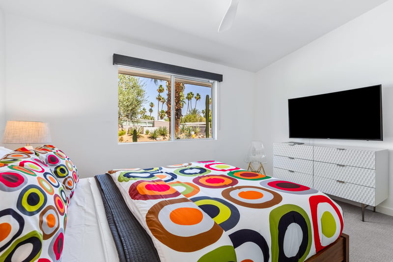 Equipped with a flatscreen TV and plenty of clothing storage.