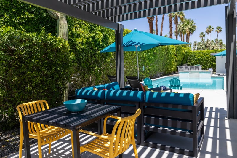 Outdoor seating under pergola.