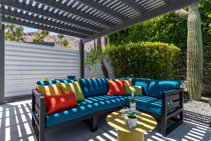 Outdoor seating under pergola.