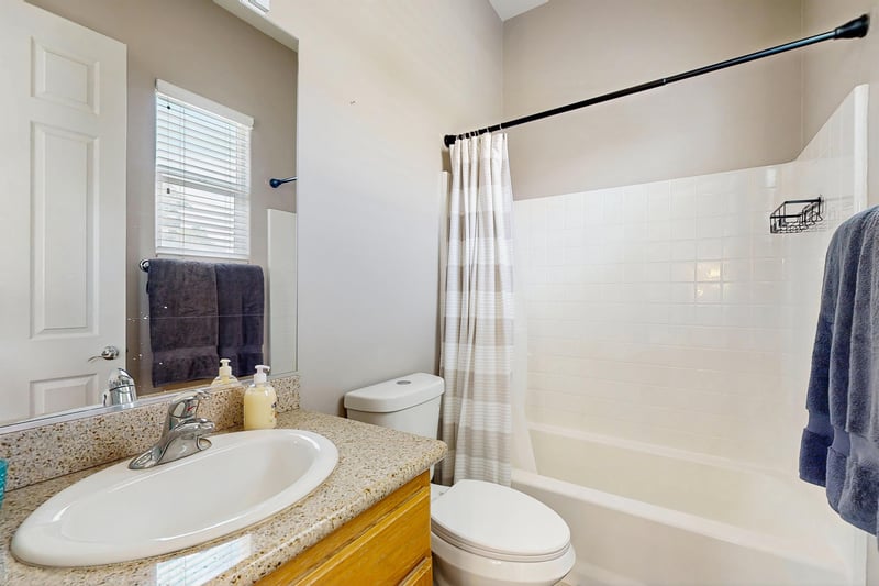 En suite bathroom with shower and tub combination.