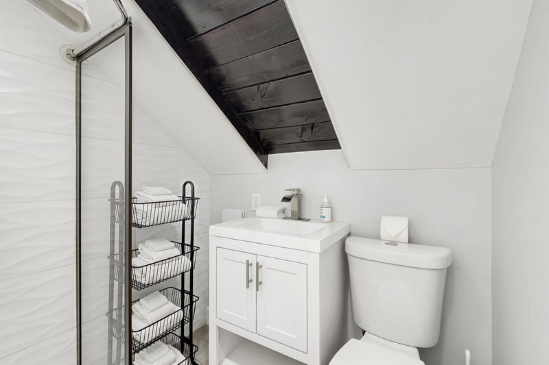 Ensuite primary bathroom with stand alone shower.
