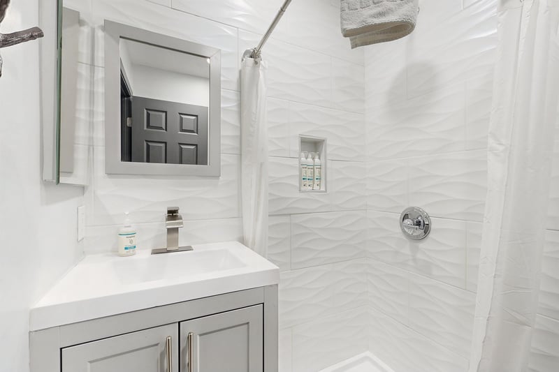 Full guest bathroom with a stand alone shower located near the 2 guest bedrooms.