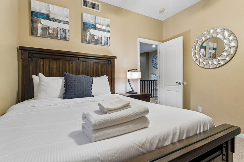 Queen size bed, closet space, and flatscreen TV.