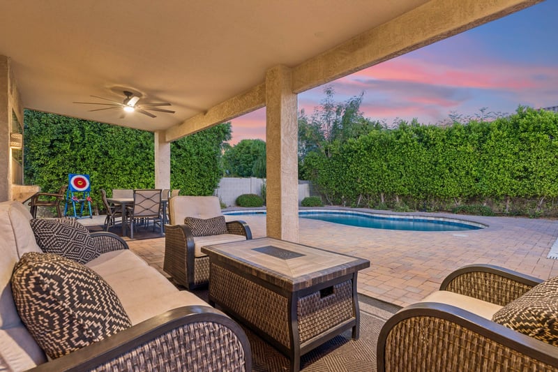 Plenty of outdoor seating on the patio overlooking the pool area, with outdoor ceiling fans.