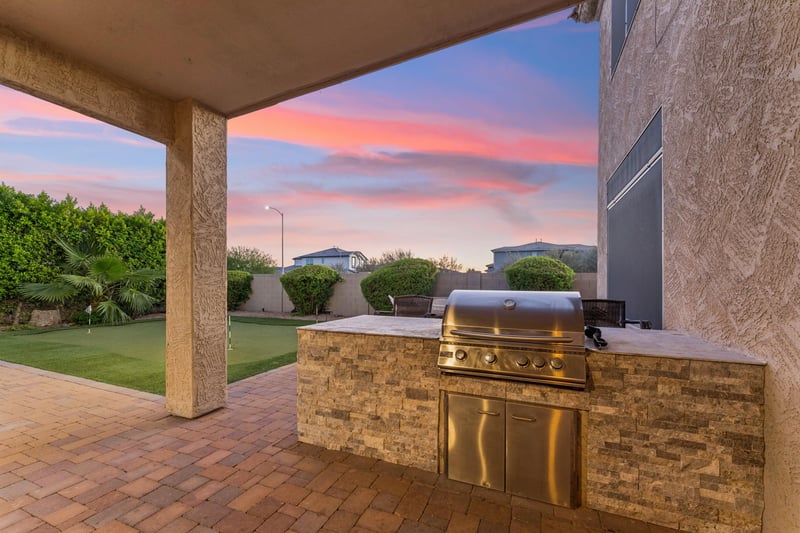 BBQ grill under the patio area.