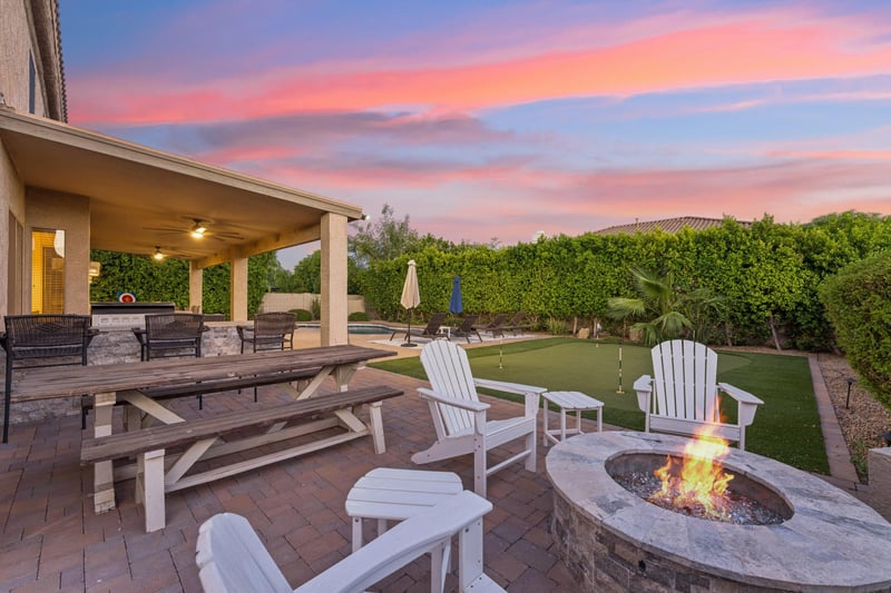 Firepit with plenty of built in seating and additional chairs.