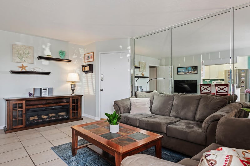 Expensive living room, facing kitchen and dining area, and patio.