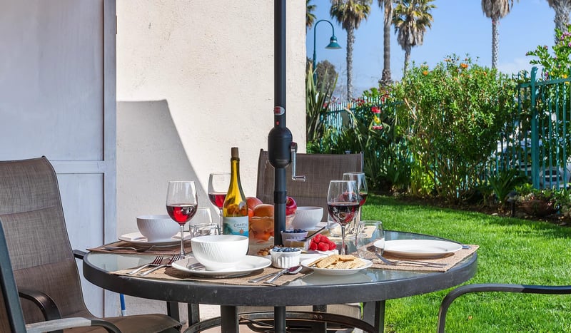 This is your east facing patio with grassy area. The beach is to the right, up a short walkway to a gated entry that leads right onto the sand.