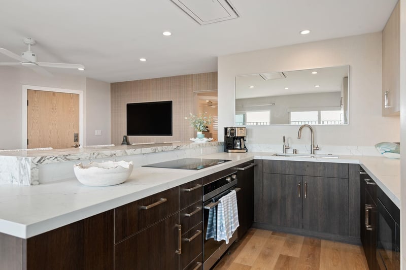 Kitchen view with all appliances and living room view.