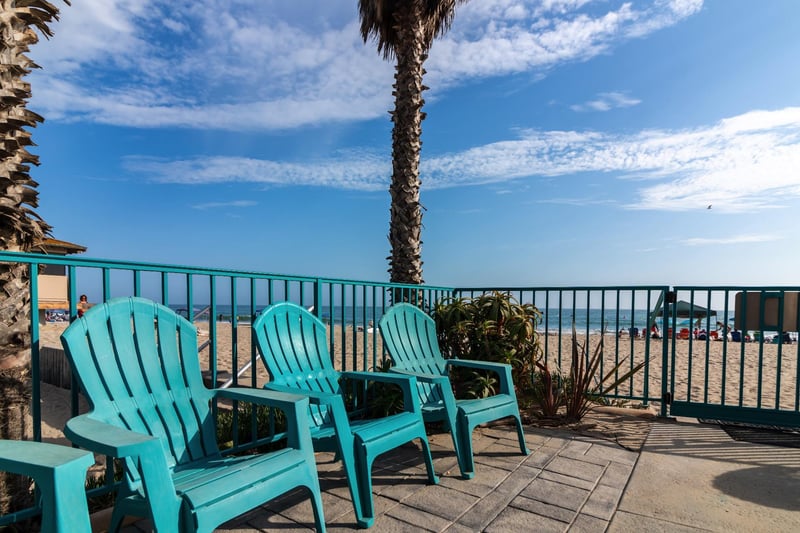 Beach entrance with lounge chairs.