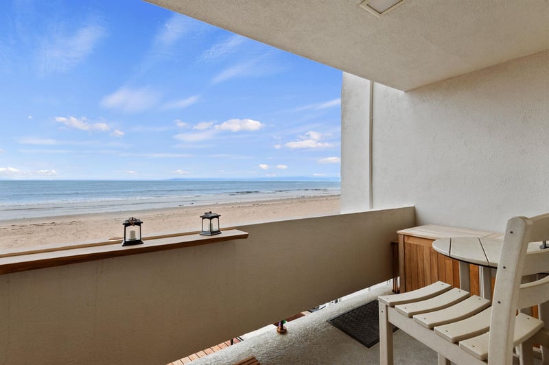 Bar top and two chairs. There is also a deck storage box to store your beach gear.