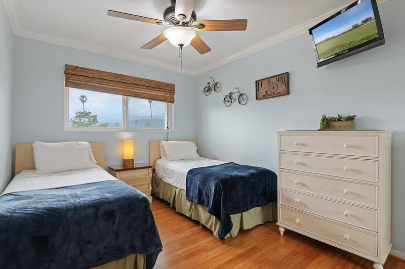 Two twin beds in the second bedroom