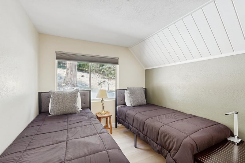 Located on the main level, two twin size beds.