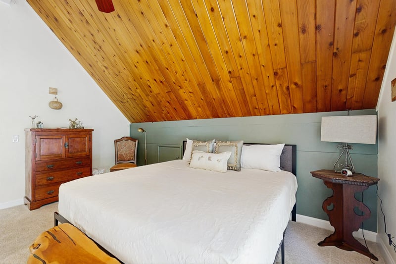 Located on the top level with a king size bed, private deck, and ensuite bathroom.