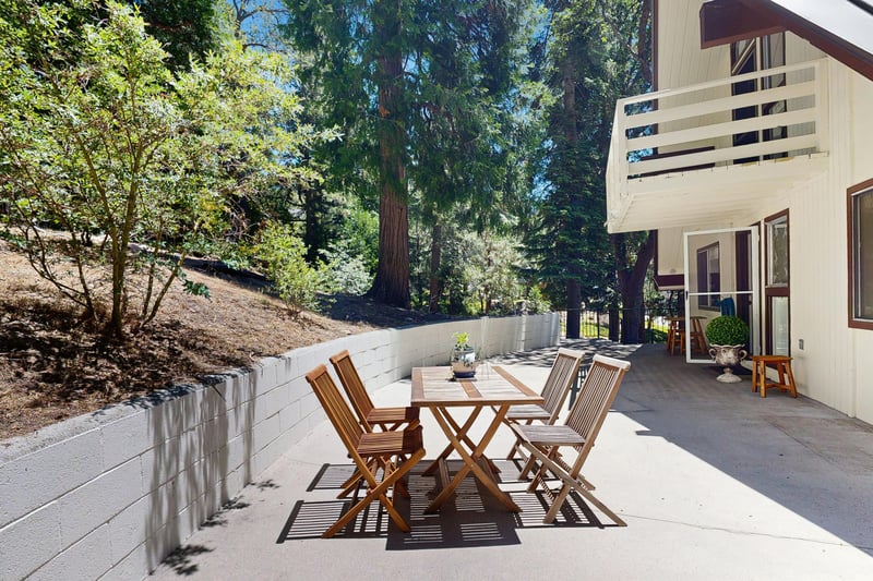 Back patio with outdoor seating, dining area, and BBQ grill.