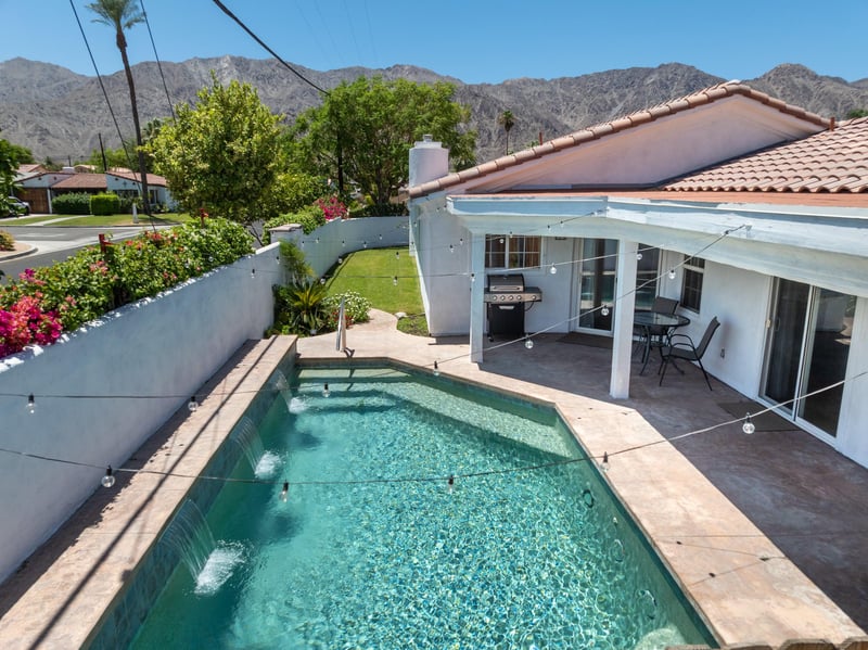 Private pool with fountains, BBQ, and patio area.