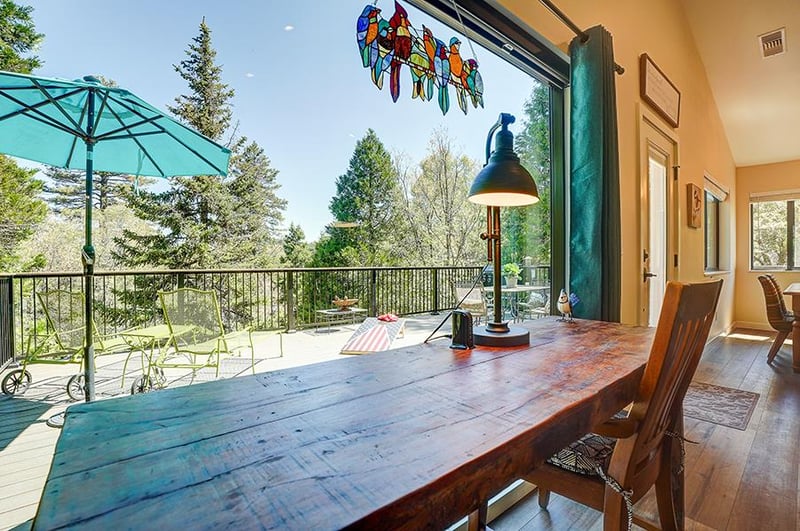Desk area in living room overlooking the deck.