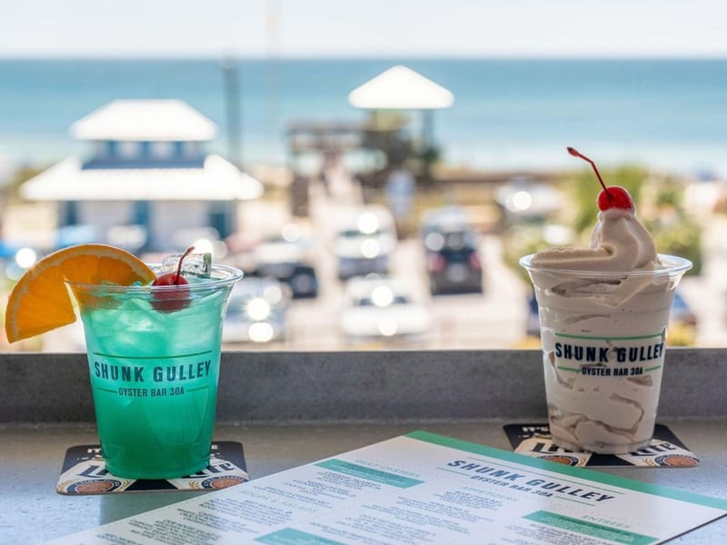 Two cocktails on the balcony at Shunk Gulley and Oyster Bar in Santa Rosa Beach, Florida