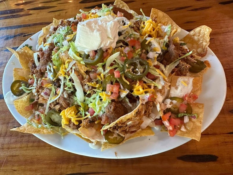 The nacho supreme served with your choice of chicken or beef at Stinks Fish Camp