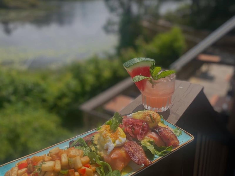 A salmon and bacon benedict with the watermelon refresher
