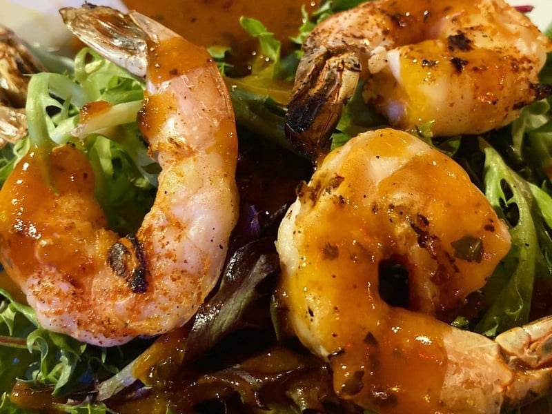 The fresh salad with grilled shrimp and a house dressing