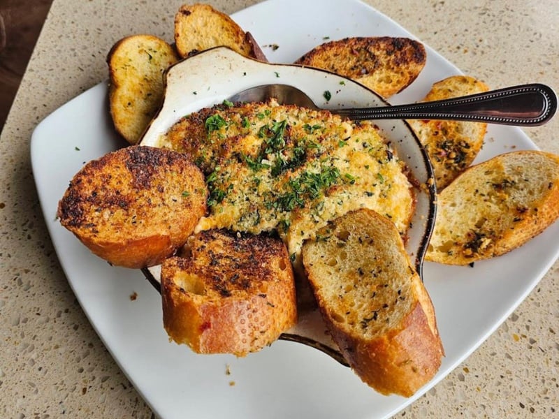 Hot crab dip with roasted garlic crostini