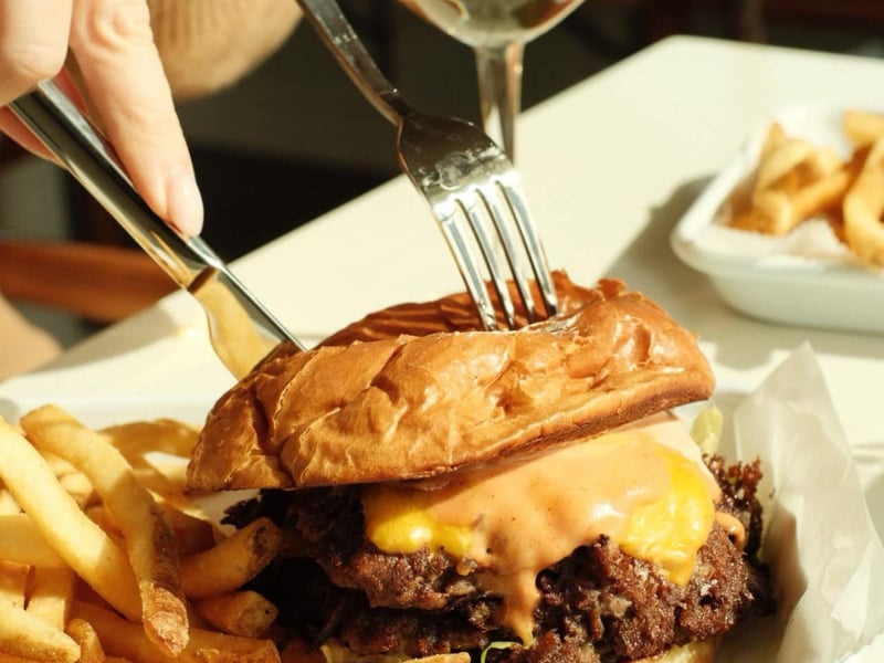 A cheeseburger with fries