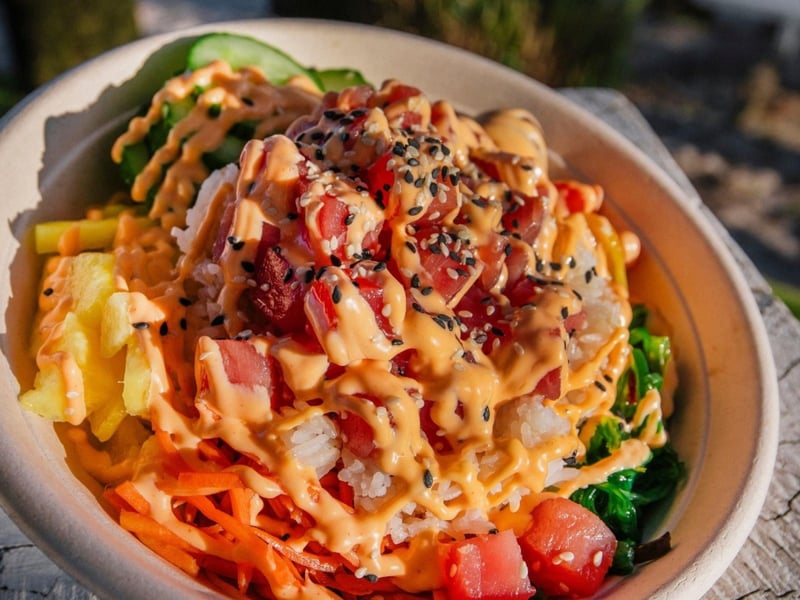 A tuna poke bowl with house made spicy tuna and ponzu